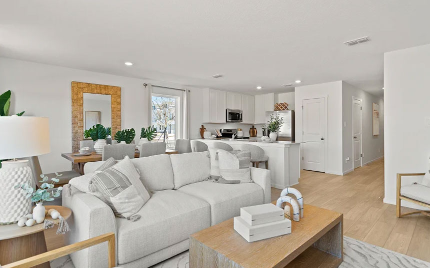 Open-concept living, dining, and kitchen area inside the Davenport townhome model
