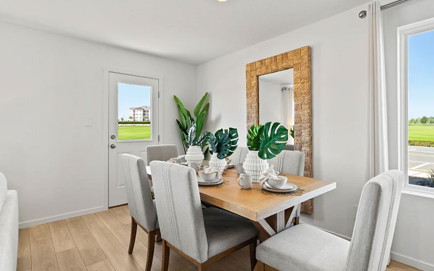 Dining area with seating for six and views of the community green space